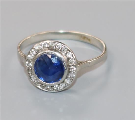 A 1920s platinum, sapphire and diamond cluster target ring, size L.